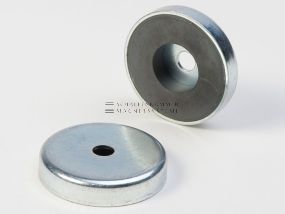 Magnetic system with cylindrical through-hole and magnetic core made of ferrite
