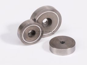 Magnetic system with cylindrical through-hole, stainless steel housing and magnetic core made of samarium-cobalt