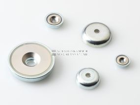 Magnet system with through-hole, 90° countersink, stamped metal housing and neodymium magnetic core