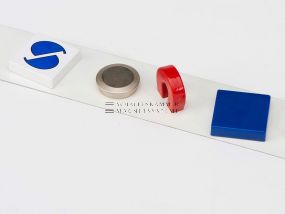 White painted sheet steel strip holds magnets