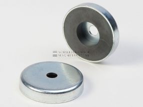 Magnetic system with cylindrical through-hole and magnetic core made of ferrite