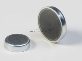 Magnetic system, pot magnet with magnetic core made of ferrite