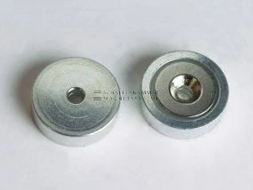 Magnetic system with through-hole, 90° countersink, turned metal housing and neodymium magnetic core